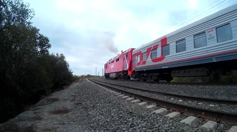 Passenger train is moving along paths Video stock 68629932