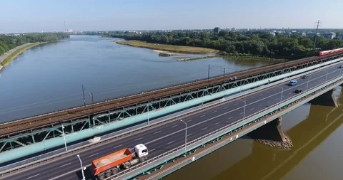Passenger Train Moving On A Bridge Through The River, Aerial Stock Footage 93339964