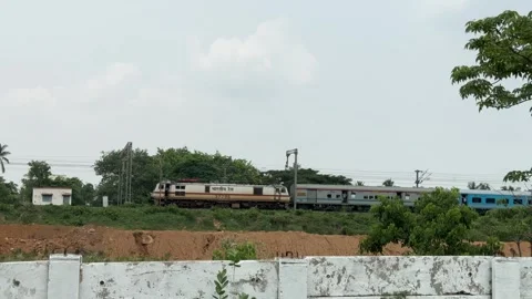 Passenger Train Moving Through Rural Landscape Near Bhubaneswar India Video stock 337983254