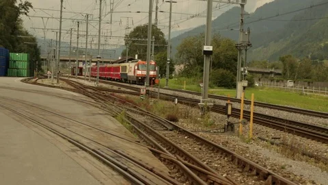 Passenger train passes camera for village Stock Footage 86757114