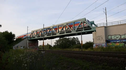 Passenger Train passes through the Bridge Stock Footage 39932322