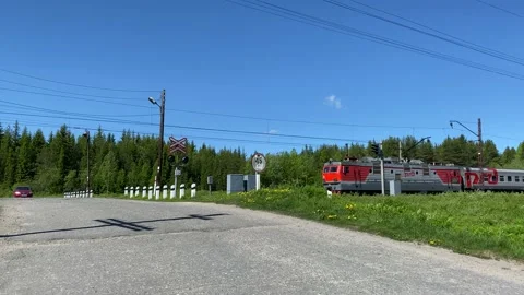 Passenger train passes through the crossing. Slow motion 4K shooting Stock Footage 132567903