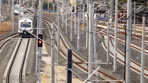 A passenger train passes under the bridge. Stock Footage 145855462