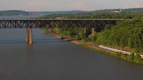 Passenger Train passes under Newburgh-Beacon Bridge in New York Stock Footage 346421727