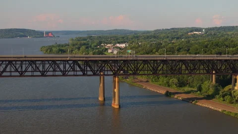 Passenger Train passes under Newburgh-Beacon Bridge in New York Stock Footage 346421803