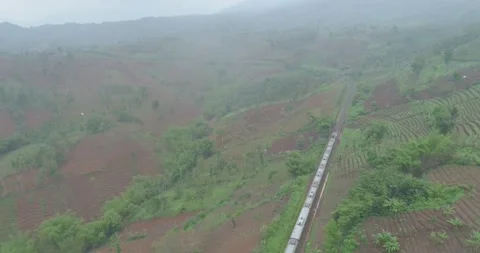 Passenger Train Passing Curves Rail and Cutting Rock Near Citiis Bridge Stock Footage 131085539