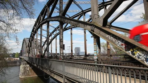 Passenger train passing by at an old iron bridge Stock Footage 49246049