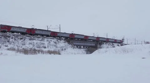 Passenger Train Passing Over Bridge in winter Stock Footage 59942876