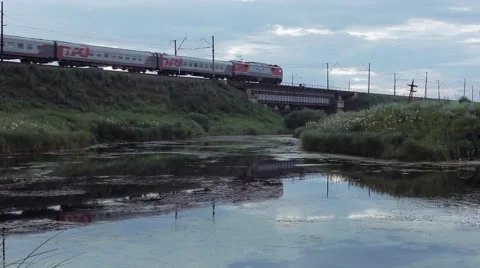 Passenger Train passing over the bridge Stock Footage 65229436