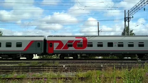 A passenger train passing from right to left at a high speed. Stock Footage 160429170