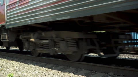 Passenger train is passing by. Side view of the wheels. Rail transport to Stock Footage 135270512