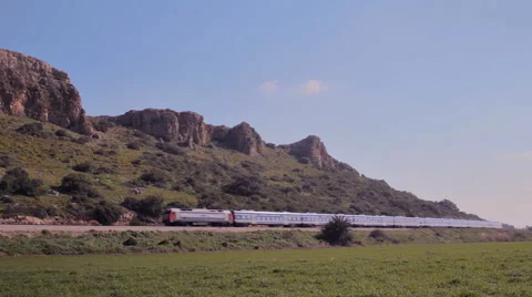 Passenger train passing through a beautiful countryside cliffs landscape 2 Vidéo 46011219