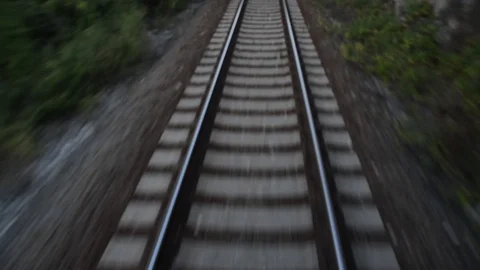 Passenger train passing through countryside on railroad. Railway tracks Video stock 102479249