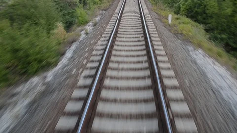 Passenger train passing through countryside on railroad. Railway tracks. Stock Footage 102479337
