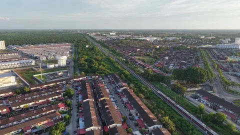 A passenger train passing through rows of suburban terrace houses Stock Footage 332160897