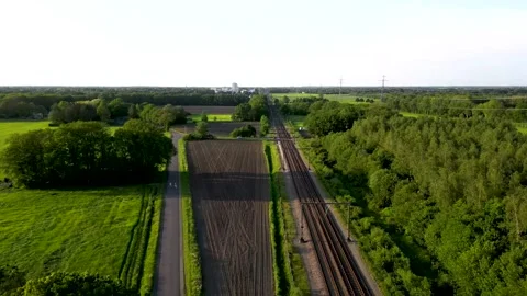 Passenger train passing through rural landscape Video stock 293943751