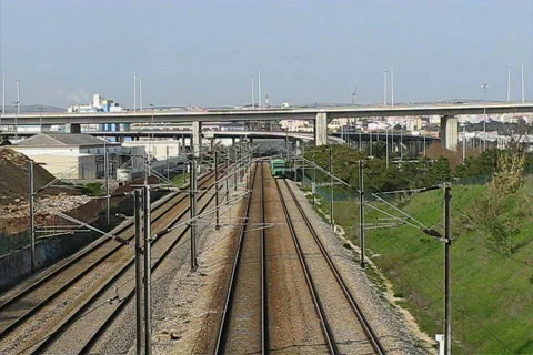 Passenger train passing under bridge Video stock 100031