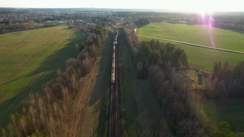 Passenger train on railway from forest, aerial view. Train with passenger cars 스톡 동영상 190068696