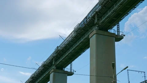Passenger train rides over bridge Video stock 169573218
