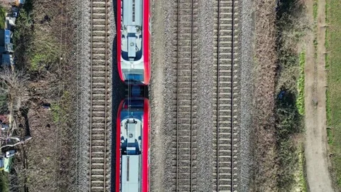 Passenger train rides on the railroad. Train travel concept. Top view Video stock 244806330