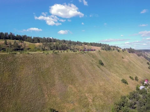 Passenger train rides through mountain. Stock Footage 77916728