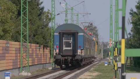 Passenger train is riding the railway. 4K footage. Stock Footage 129233927