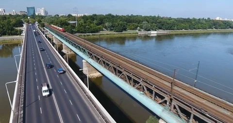 Passenger Train Running Towards Camera On A Bridge. Aerial Shot Stock Footage 93343373