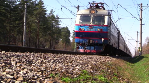 Passenger train RZD rides from the station. Spring. Russia. Moscow region. Stock Footage 40367441