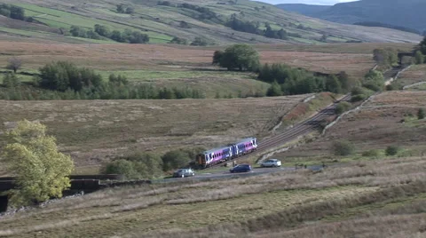 A passenger train on the Settle to Carlisle railway line Stock Footage 42631485