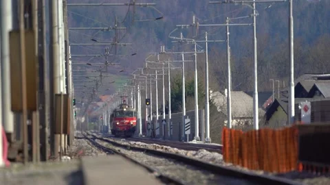 The passenger train is slowly approaching the station Stock Footage 237183008