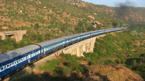 Passenger train slowly pulls into station near Bangalore Stock Footage 20954025