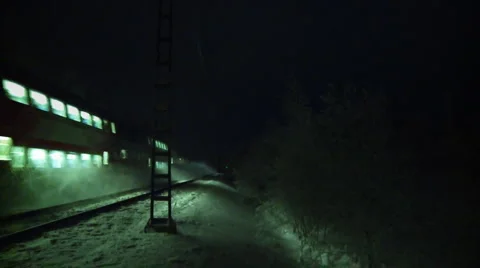 Passenger train on a snowy night Stock Footage 2242410