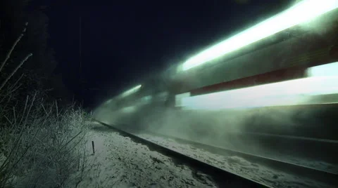 Passenger train on a snowy night Stock Footage 2244465