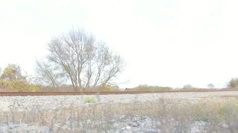 Passenger Train Speeding By, Low Angle Video stock 12532974