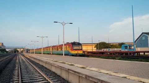 Passenger Train Station Platform and Railway Tracks at Sunset Stock Footage 342216635