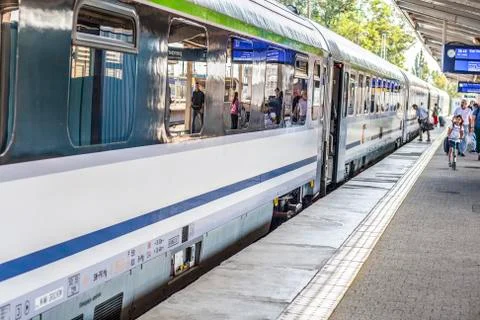 Passenger train at station platform Stock Photos