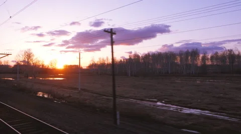 Passenger train at sunset on the TRANS-Siberian Stock Footage 62502774
