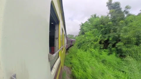 Passenger train in Thailand. Window view. Forest. Video stock 51123156