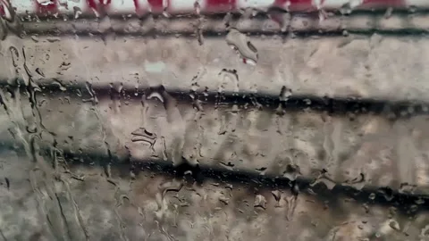 Passenger Train Through Rain Covered Glass Window 動画素材 347933508