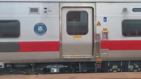 Passenger Train travelling through station - Close up and then Wide Shot Stock Footage 118997785