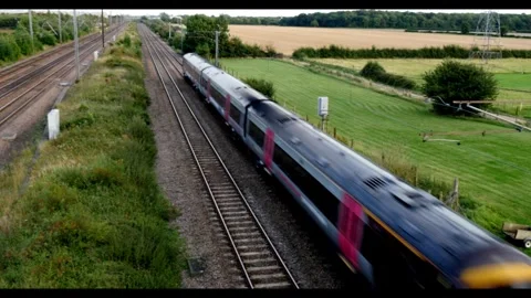 Passenger Train on UK track (4K) Stock Footage 272999862