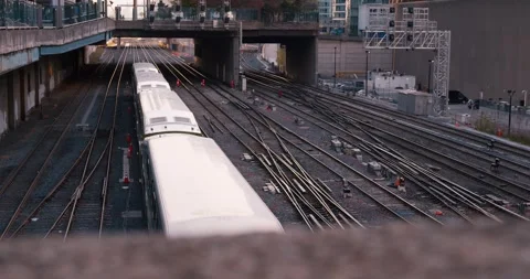 Passenger train under bridge multi-track road. journey, emblem exploration Stock Footage 262544607