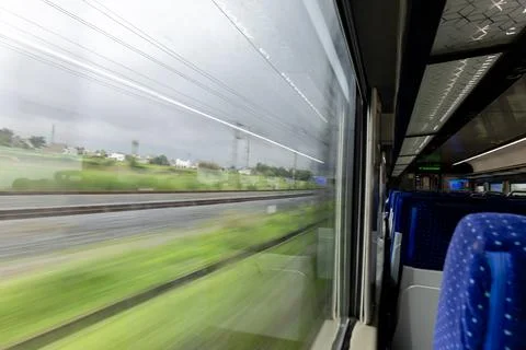 Passenger Train Window View During Daytime with motion blur 库存照片