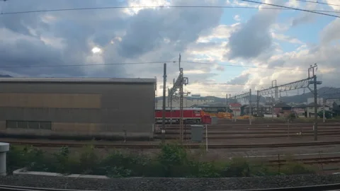 Passenger train window view of railroad tracks  in Kyoto, Japan Stock Footage 333634277