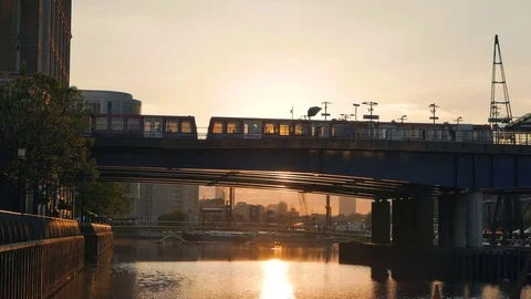 Passenger trains crossing on the platform at sunset Stock Footage 75172657