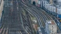 Passenger trains moving back and forth on railroad tracks, top view, timelapse HD Footage