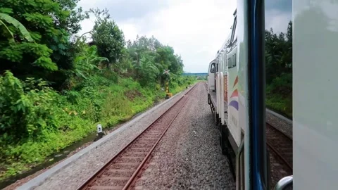 Passenger trains run on the Trans Java route at medium speed Stock-Footage 274692510