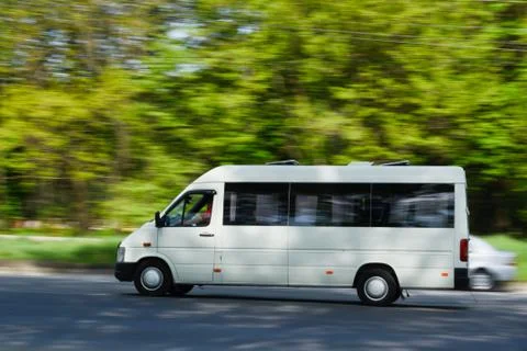 A passenger van in motion Stock Photos