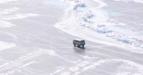Passenger Van Rides On The Surface Of The Ice-covered Lake Stock Footage 104198161