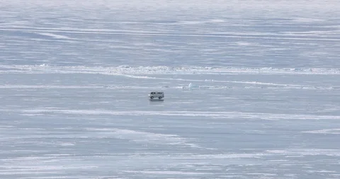 Passenger Van Rides On The Surface Of The Ice-covered Lake Stock-Footage 104198189